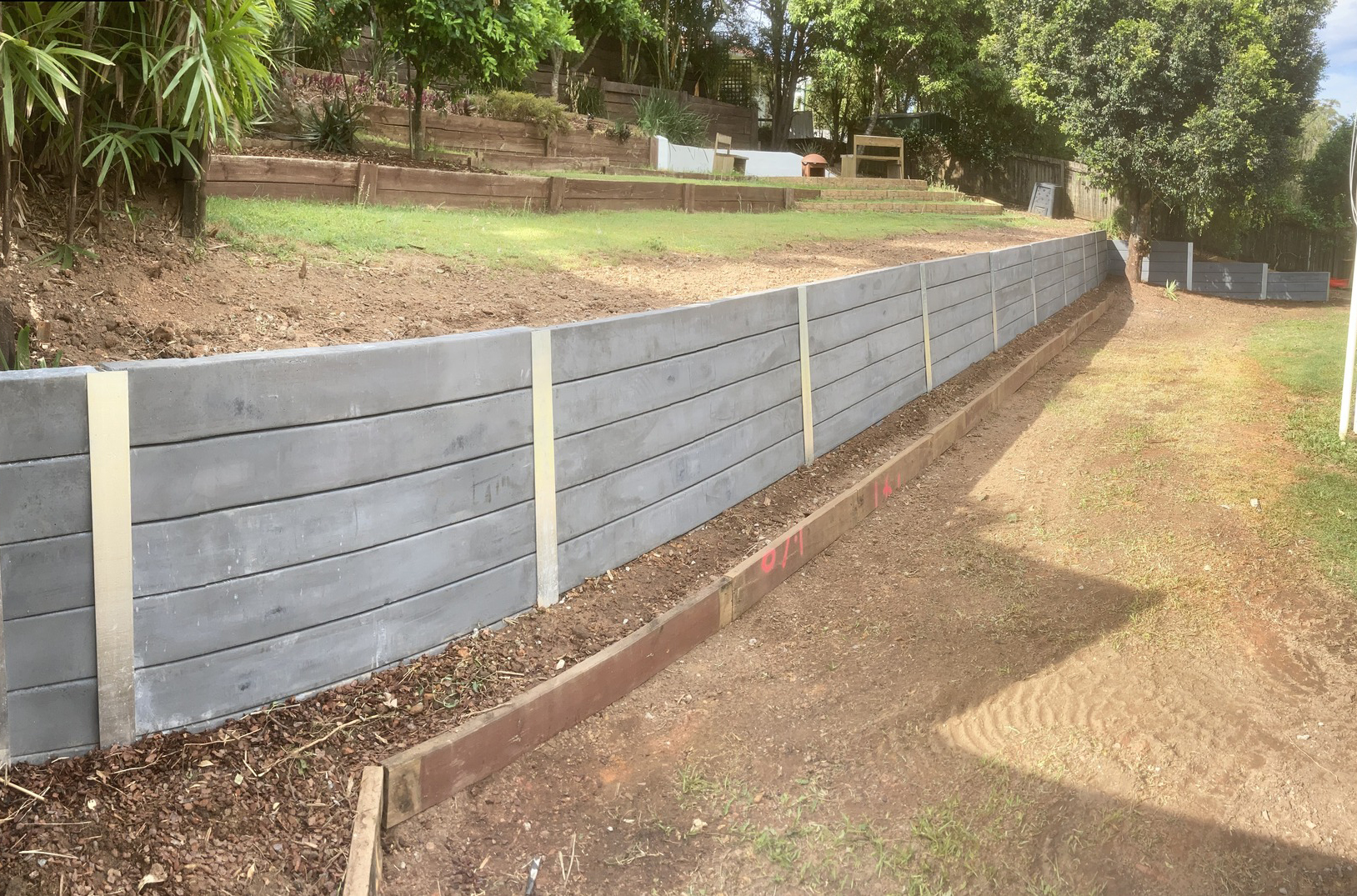 Industrial Charcoal sleeper retaining wall by Ardagh Construction